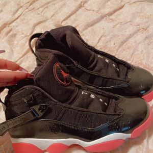 Women’s pink and black 6 rings